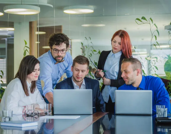Engineers reviewing code together at a workstation